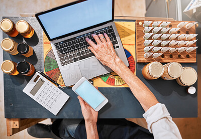 Buy stock photo Hands, laptop and honey with a retail woman checking her phone while working at a desk in her store. Computer, ecommerce and email with a female employee typing a text message at work in her startup