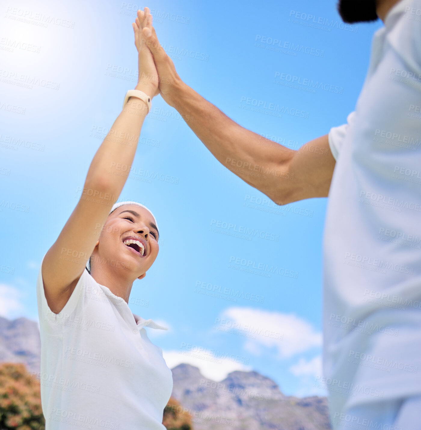 Buy stock photo Couple, high five and nature with love, happy in low angle for vacation, holiday or romance in sunshine. Black couple, hands support and sky to relax at mountain, resort or adventure for love goal