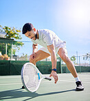 Sports, tennis and leg injury on court after training, game or match. Tennis player, healthcare and male athlete drop racket with injured knee, muscle pain or inflammation after workout or exercise.