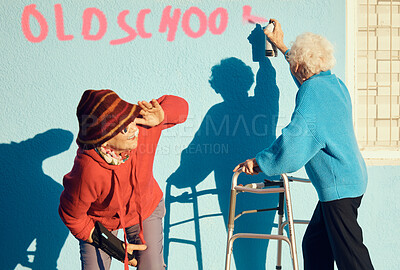 Buy stock photo Senior women, friends and spray paint for vandalism, graffiti and street art to spray old school on nursing home building wall and keep watch. Crazy old people break law with illegal activity outdoor
