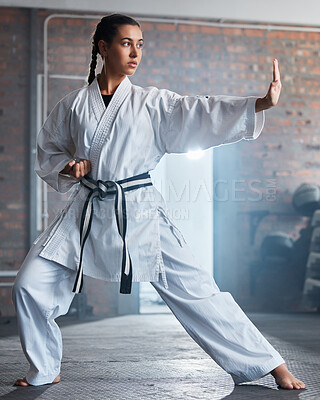 Karate training, fitness and woman in gym, healthcare motivation and strong focus for fight workout. Fist, sport exercise and healthy athlete person or martial arts wellness for taekwondo competition