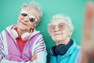 Buy stock photo Senior women, fashion and retro selfie with sunglasses, headphones and vintage clothes with cool mindset outdoor. Portrait of aesthetic old people or friends together for pop art profile picture