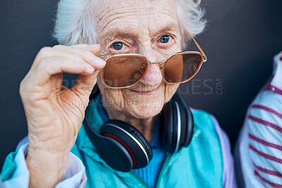Buy stock photo Glasses, cool and fashion portrait of old woman with music headphones, luxury senior style or creative accessory. Vision, wellness and face of elderly retirement person with designer brand sunglasses