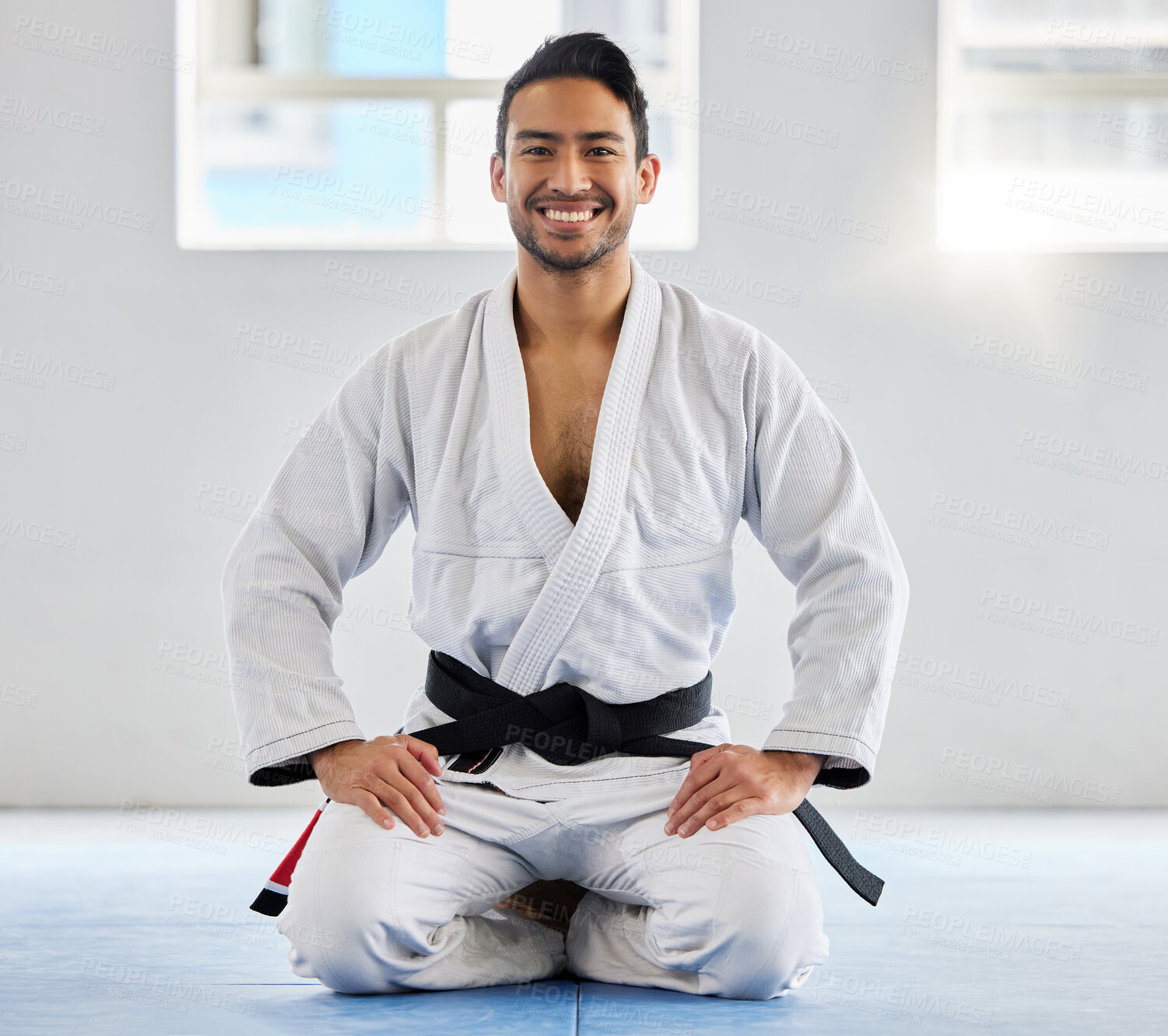 Buy stock photo Karate, fitness and athlete, man with black belt and martial arts portrait, training and discipline with exercise. Taekwondo, combat sport and active with power and strong, sports motivation in dojo.