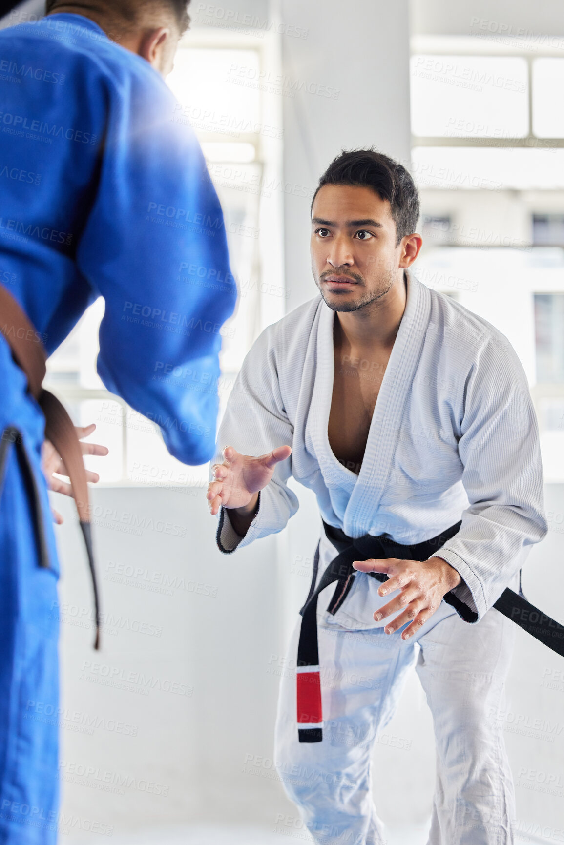 Buy stock photo Men, martial arts and karate training in dojo to practice fighting skill. Taekwondo, fitness or self defense class for workout, battle exercise or sports challenge of people in match or competition.
