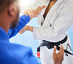 Man, closeup and karate training fight in gym, dojo and combat sport for exercise. Man, self defence and workout with black belt sensei at fitness club for body health, balance or martial arts sports