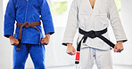 Karate, dojo and men in uniform for training, exercise or a fight competition, tournament or championship. MMA, martial arts and fighter athletes in a gi suit for a workout or practice in a gym.