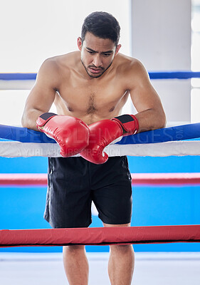 Buy stock photo Man, tired boxer and training for boxing match, cardio fighting workout and fight exercise. Fitness sports motivation, learning to box for competition tournament and rest on rope of gym boxing ring 
