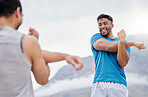 Arm stretching, health and friends in nature for fitness or wellness. Training, exercise and happy men, group or people warm up arms together getting ready for running, workout or cardio outdoors.