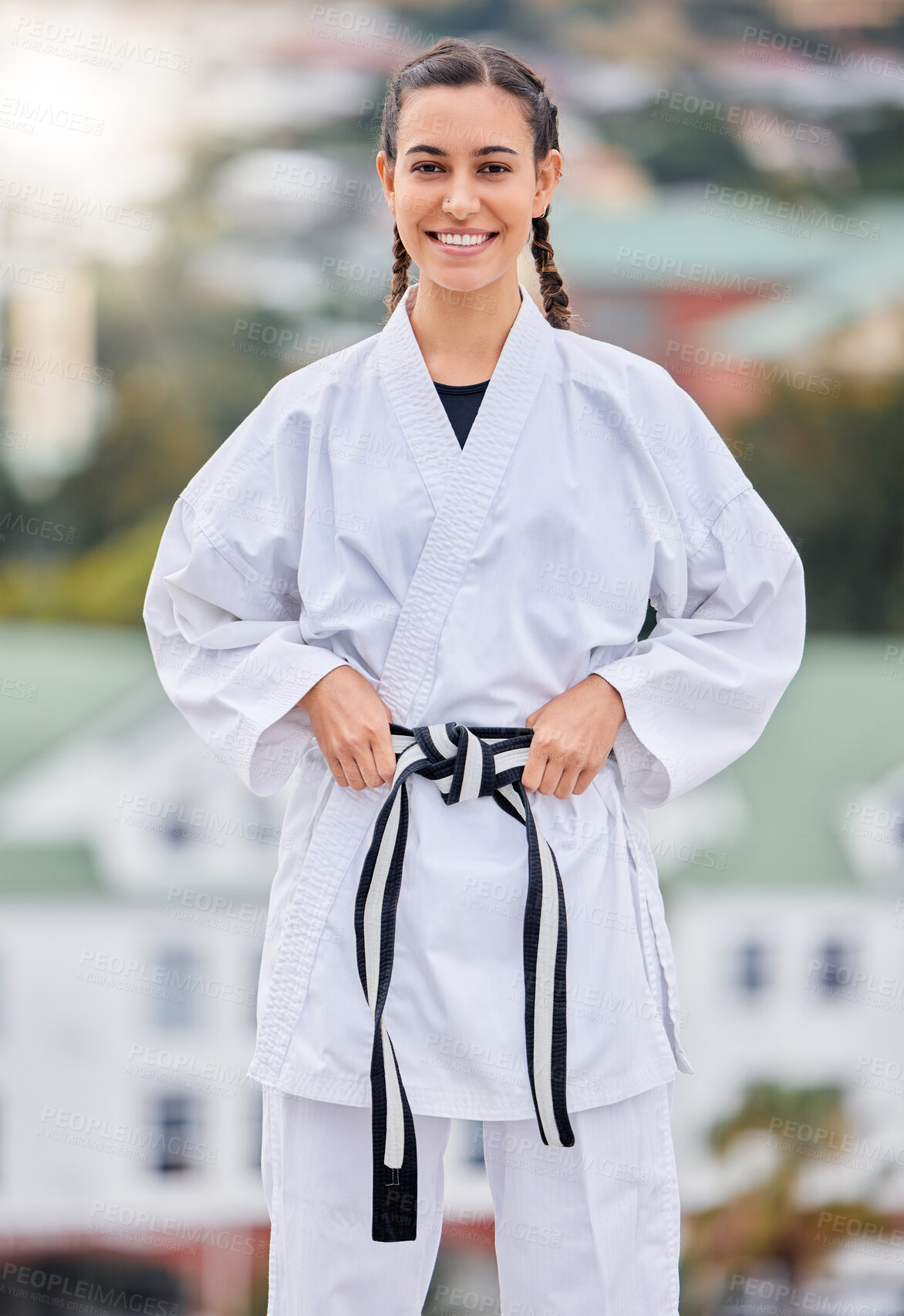 Buy stock photo Woman, karate and smile in outdoor portrait with happiness for training, fitness and wellness in sunshine. Girl, martial arts and self defence with happy, sport and motivation in metro, town or city