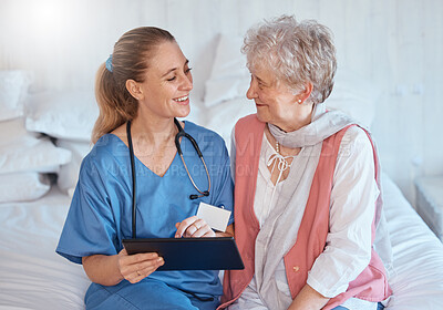 Buy stock photo Happy, tablet and nurse consulting an old woman with medical report results or doctor healthcare diagnosis. Smile, bed and social worker helping, talking or speaking to a healthy elderly person 