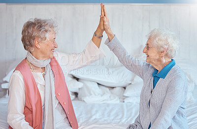 Buy stock photo Elderly woman, friends high five and sitting in bedroom with smile, happy or together in nursing home. Senior women, best friends and happiness with support, empathy and care while on bed in house