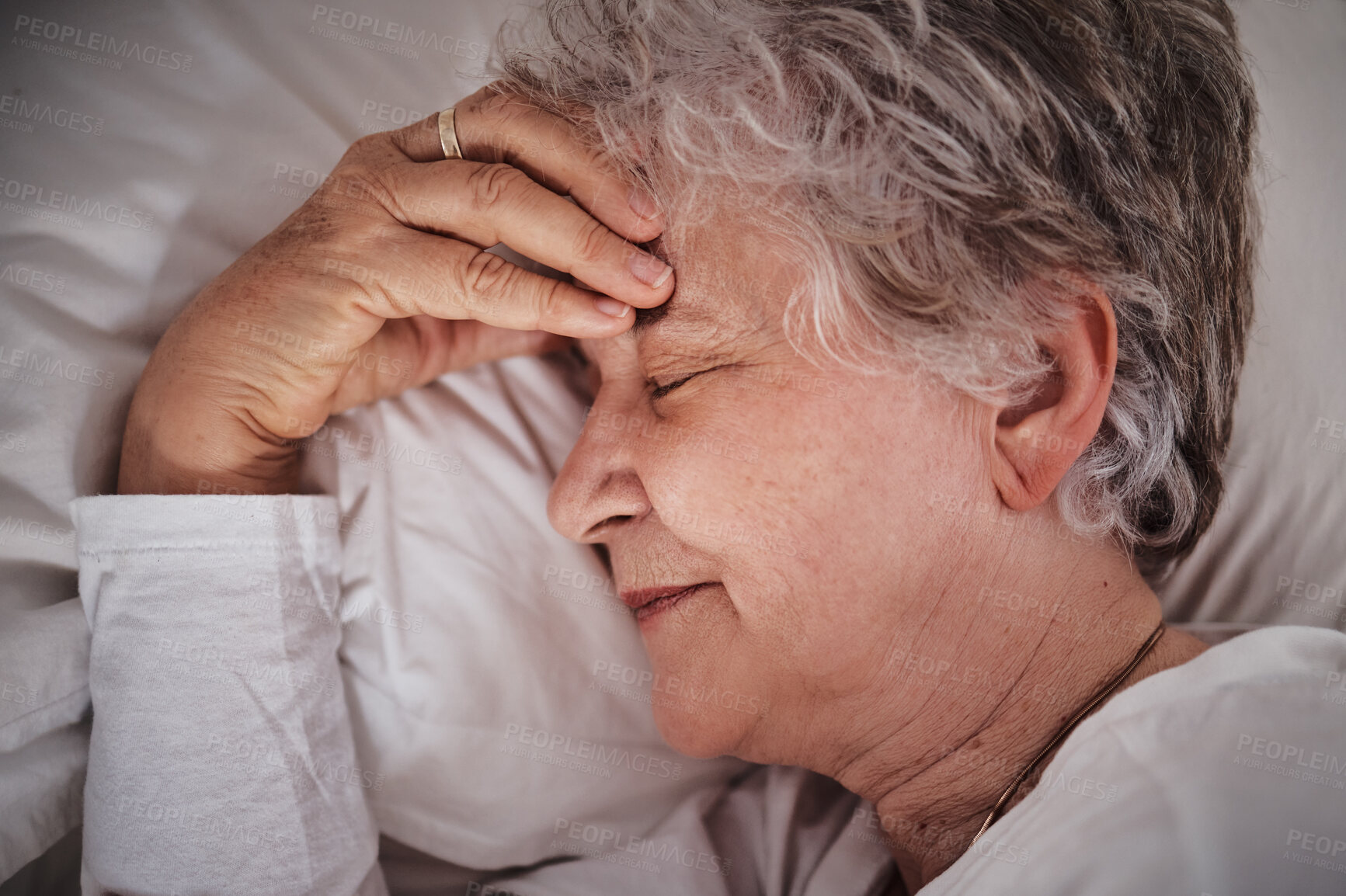 Buy stock photo Sleep, headache and senior woman in a bed with stress, anxiety and tired. Sick, sad and face of an elderly lady dreaming with depression and sleeping in her bedroom for rest during retirement