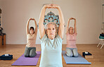 yoga, stretching and elderly women class for fitness, healthcare motivation and body wellness in health studio. Zen meditation, chakra energy and senior people stretch arms for exercise training