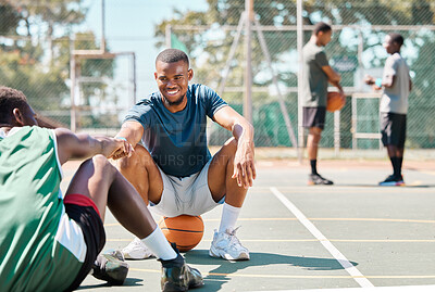 Buy stock photo Sports, basketball and friends, men relax and fist bump on basketball court in happy summer. Friendship, teamwork and basketball player sitting on ground with friend and ball in community playground.