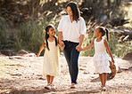 Mother, children and park walking holding hands with girl and mama in summer with happiness. Kids love, smile and kids care relax in nature with mom support and sunshine together feeling happy