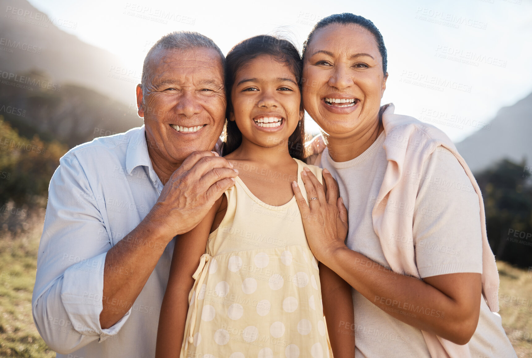 Buy stock photo Happy, portrait and grandparents with girl in nature for family, relax or support. Embrace, bonding and summer with old man and woman smile with grandchild for affection, hug or  youth in countryside