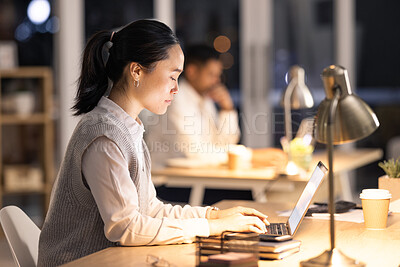Buy stock photo Night, laptop and woman with digital marketing research for creative social media posts, content and ideas. Focus, startup and Japanese worker typing or working on an advertising strategy in a office