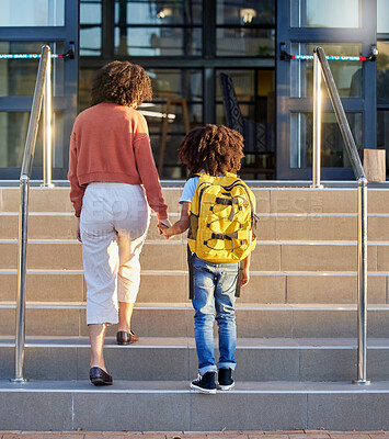 Buy stock photo Mother, child and holding hands at school building, education with backpack and ready to learn at academy. Learning, study and student, black woman support kid for first day back to school.