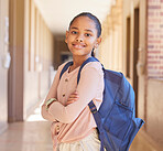Backpack, happy and portrait of a girl at school in the hallway for education, knowledge and learning. Happiness, smile and child student standing with a bag in the aisle before study class on campus