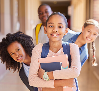 Buy stock photo Education, children and portrait of friends at school together standing in the hallway for class. Diversity, backpack and happy students with a smile playing in the corridor of the campus with books.