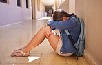 Bullying, depression and sad student, girl and mental health problem in education hallway. Social anxiety, depressed or angry teen kid, floor and crying, stress or conflict, abuse and fear of failure