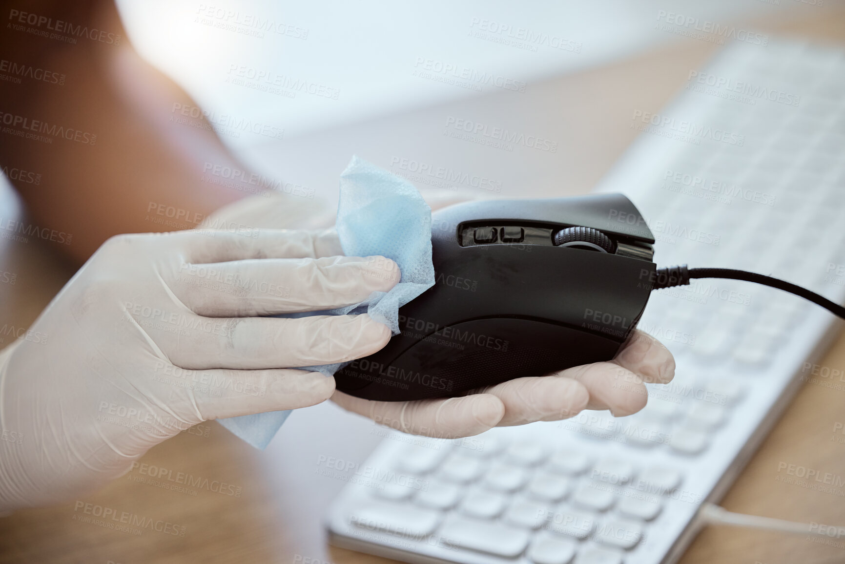 Buy stock photo Computer mouse, hand and wipe to disinfect during covid for health, government compliance and wellness at workplace. Gloves on woman at office for covid 19 virus sanitizer and cleaning of equipment