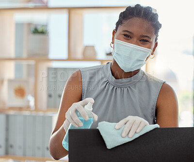 Buy stock photo Covid, mask and sanitizer with a business black woman cleaning her computer and office equipment at work. Portrait, sanitizing and wipe with a female employee during the corona virus pandemic