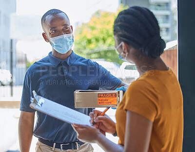 Buy stock photo Covid, delivery and man with a box for a black woman in face mask for coronavirus compliance after online shopping. Ecommerce, thank you and African girl customer signing paper on a clipboard at door