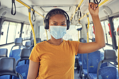 Buy stock photo Bus travel, covid and black woman, headphones and music, podcast or radio on urban journey, transport and trip. Portrait of young traveler listening to audio, face mask and corona virus safety rules