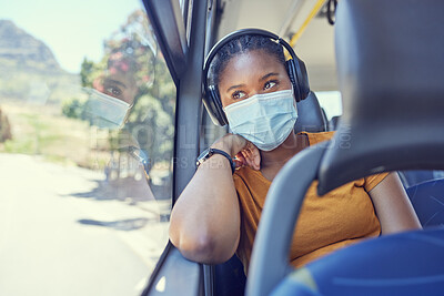 Buy stock photo Black woman, covid and mask with headphones in transport for safe traveling, trip or destination during pandemic. African American female in public transportation with face mask for health and safety