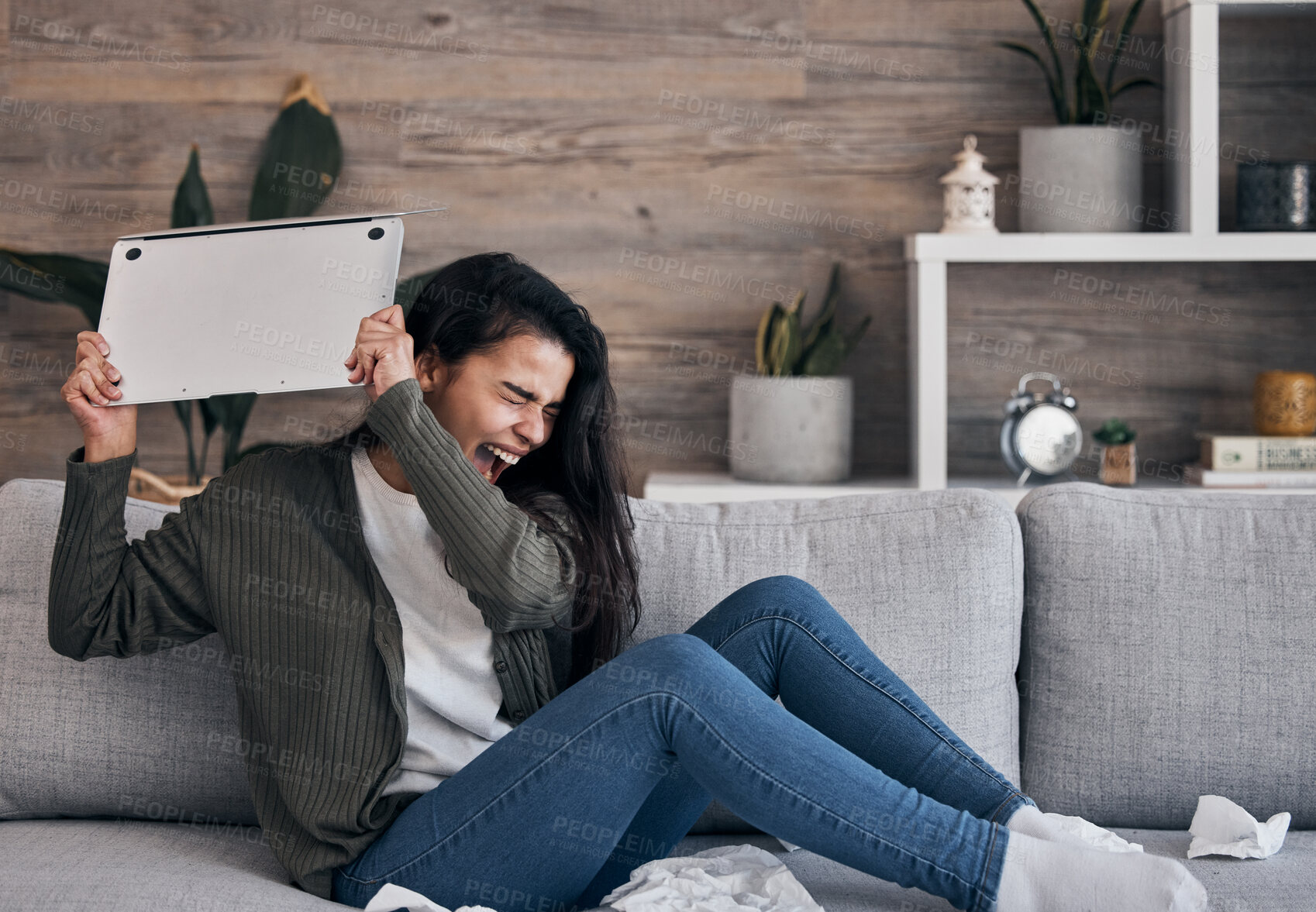 Buy stock photo Woman on sofa, angry and throwing laptop while crying in living room, breakup email or work stress at home. Mental health, depression and sad girl on couch with computer, glitch or 404 error burnout