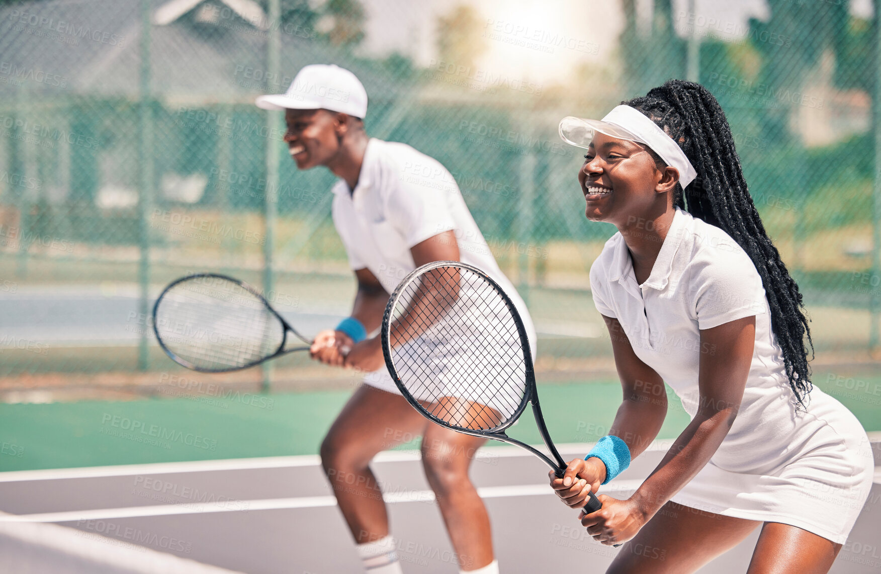 Buy stock photo Tennis, sports and competition with a black woman and doubles partner playing a game on a court outdoor together. Fitness, team and exercise with a man and female tennis player at a venue for sport