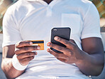 Black man, hands and phone with credit card for online banking, ecommerce or remote transaction. Hand of shopper using mobile smartphone and card for banking app, digital payment or wireless purchase