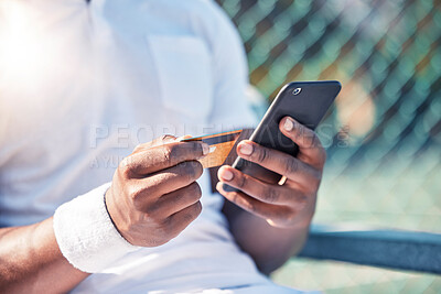 Buy stock photo Credit card, phone and online shopping with a sports man making a payment online while sitting at a court. Finance, ecommerce and retail with a male athlete buying or browsing the internet outdoor