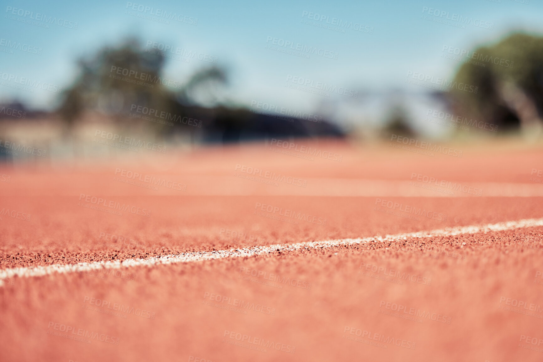 Buy stock photo Stadium, clay running track and closeup of outdoor arena or sport pitch. Fitness, training and sports ground for running wellness, workout or healthy exercise for cardio runner development on field 