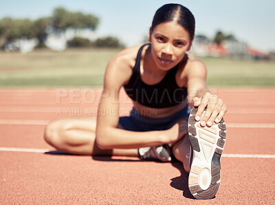 Buy stock photo Stretching, feet and sports woman at stadium or race track with fitness training, workout and exercise goals for legs, muscle and body. Athlete or runner warm up on ground for a marathon competition