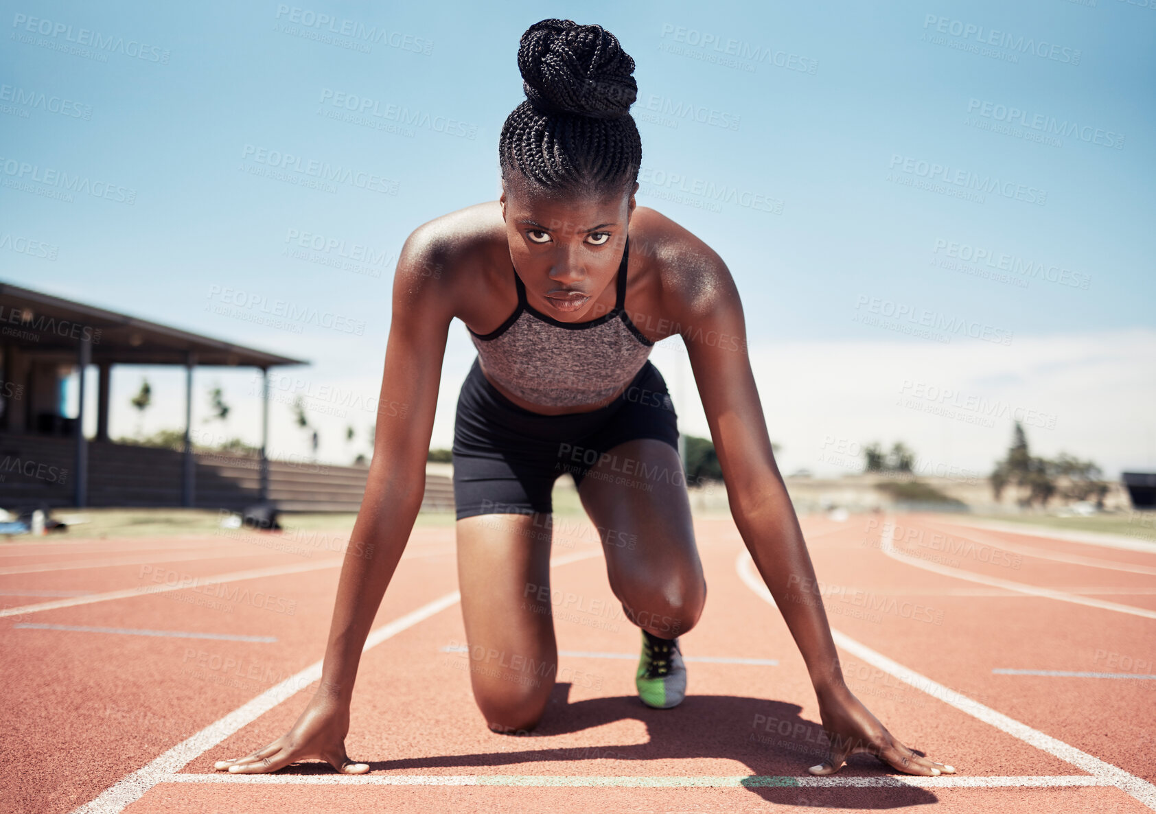 Buy stock photo Black woman, runner and start line, race and competition, exercise challenge or fitness at stadium arena. Portrait, focus and sports athlete ready on running track, marathon training and cardio power