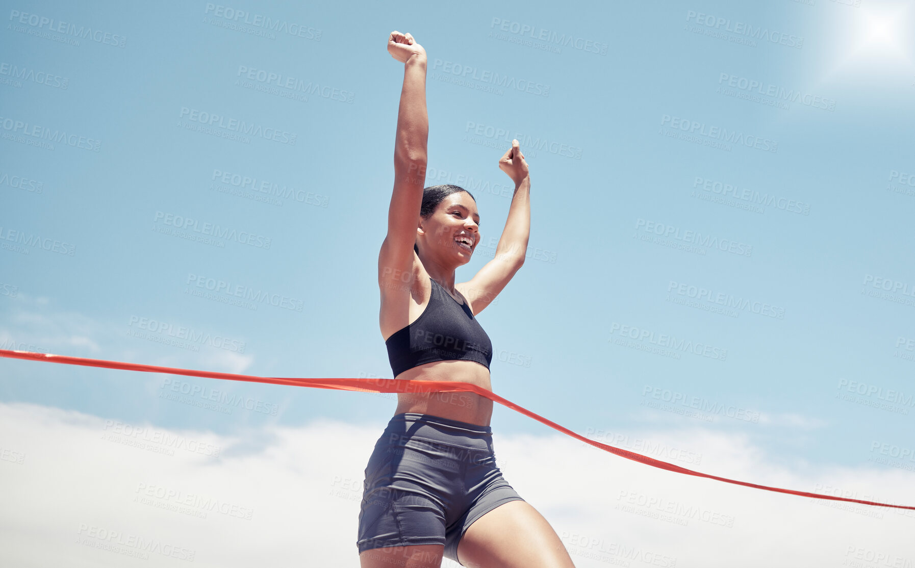 Buy stock photo Fitness, winner and sports woman running a race and winning first place in summer in track competition. Runner, goals and happy girl athlete with hands up smile in celebration of a marathon success 