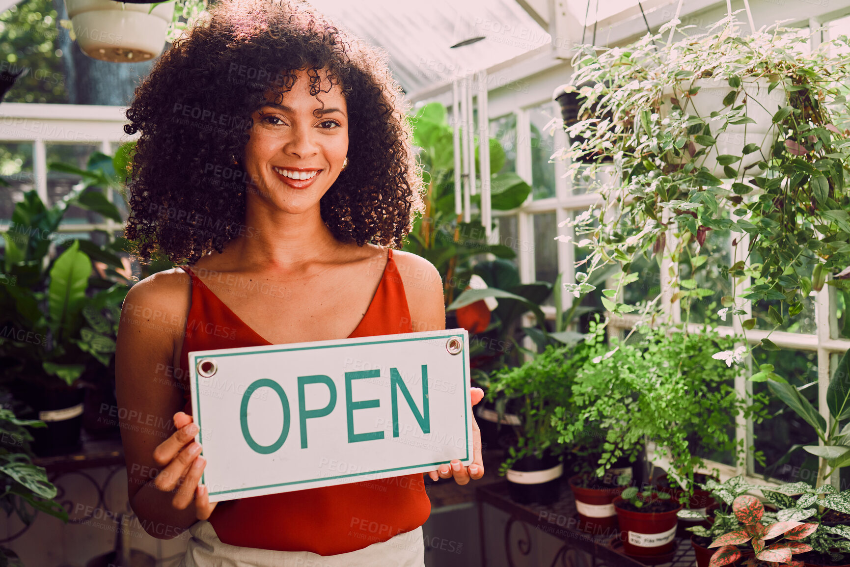 Buy stock photo Plant shop, open sign and portrait of a woman with a small business standing in her retail nursery. Happy, smile and female entrepreneur from Brazil with a leaf, nature or organic store holding board