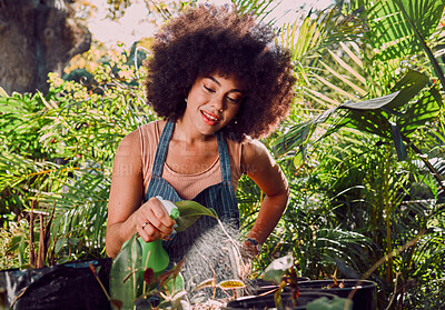 Buy stock photo Black woman, water and spray bottle for plants, garden and eco friendly outdoor flowers. Agriculture, sustainability or African American female gardening, growth or liquid for ecology, flora or relax