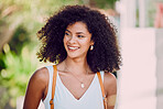 Woman, smile and happy with backpack for travel, holiday or walking in small town in Mexico. Female, bag and attractive happiness on face as tourist walk in city, afro or happiness and vacation 
