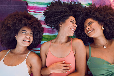 Buy stock photo African women, happy and friends on floor for support, love and care or bonding together at beach. Black girls, smile and friendship happiness, laughing with afro and fun on summer holiday
