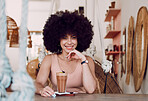 Black woman in coffee shop portrait with drink, relax with natural hair and smile, happy alone for self care date and pride with afro for self love. Happiness, African woman in cafe for coffee break.