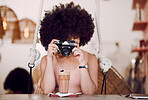 Camera, photography and woman in coffee shop for content marketing, drink advertising and menu update on website or social media. Black woman influencer, photographer or content creator in restaurant