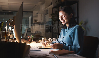 Buy stock photo Work, overtime and woman reading smartphone with tablet and computer working late on online design project. Night at office, happy designer networking for creative startup and checking social media.