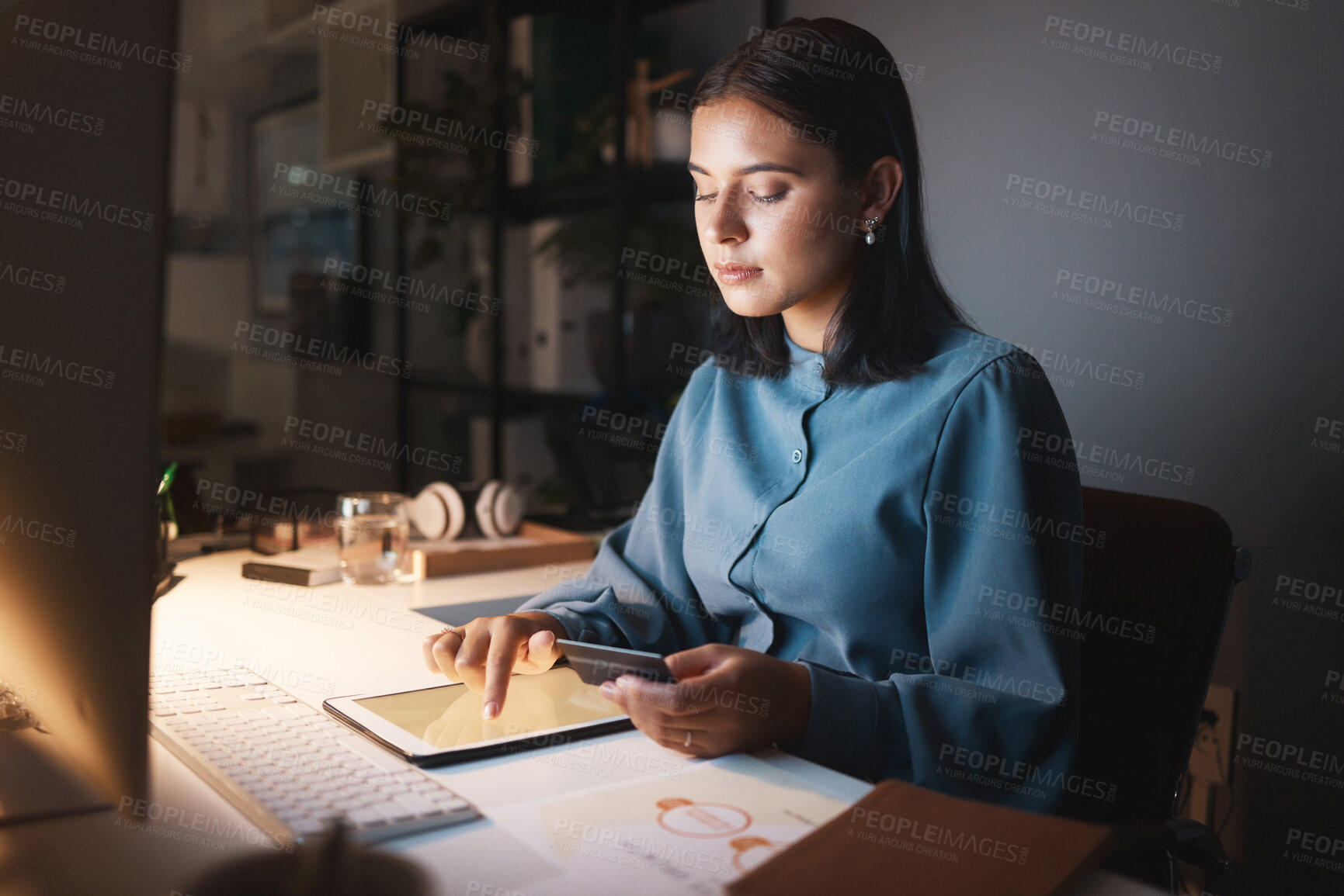 Buy stock photo Online shopping, night and business woman with tablet typing in credit card details, payment and account data. Ecommerce, digital technology and girl by desk in dark office doing internet banking