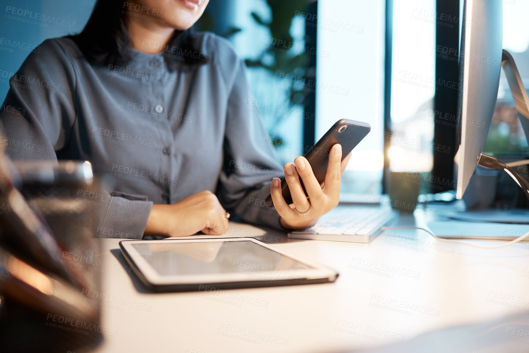 Buy stock photo Tablet, phone and business woman at desk sitting in corporate office working online. Technology, digital marketing and hands of female worker using smartphone for research, internet and social media