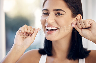 Buy stock photo Flossing, dental and woman teeth cleaning for healthcare and wellness in a home bathroom. Healthy smile and dentist care of a person with happiness from dental care and teeth whitening results