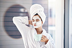 Woman, facial mask and drinking coffee after morning shower, body wellness and healthy skincare cosmetics in home bathroom. Funny, pout lips and young female, face mask and clean beauty cosmetology 